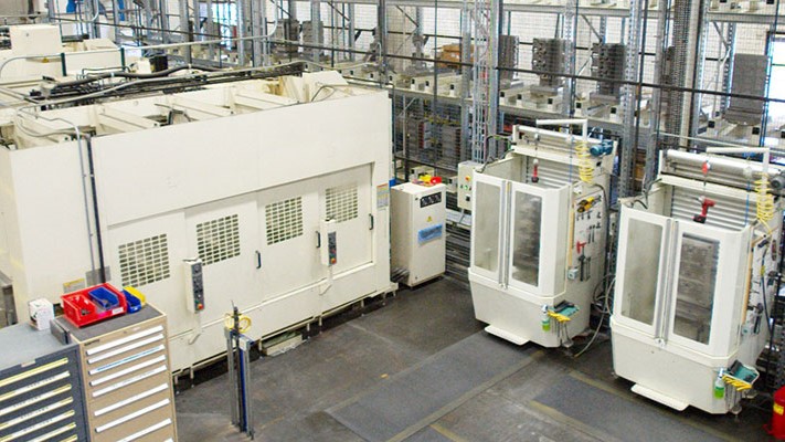 QuadMetalworks' flexible manufacturing system equipped with 2 Okuma MA-50 Horizontal Machining Centers and a 48-pallet storage and shuttle system