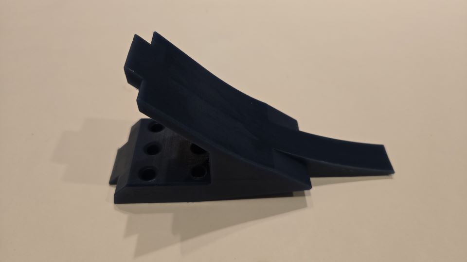 Plastic wedge produced by QuadMetalworks for a printing client